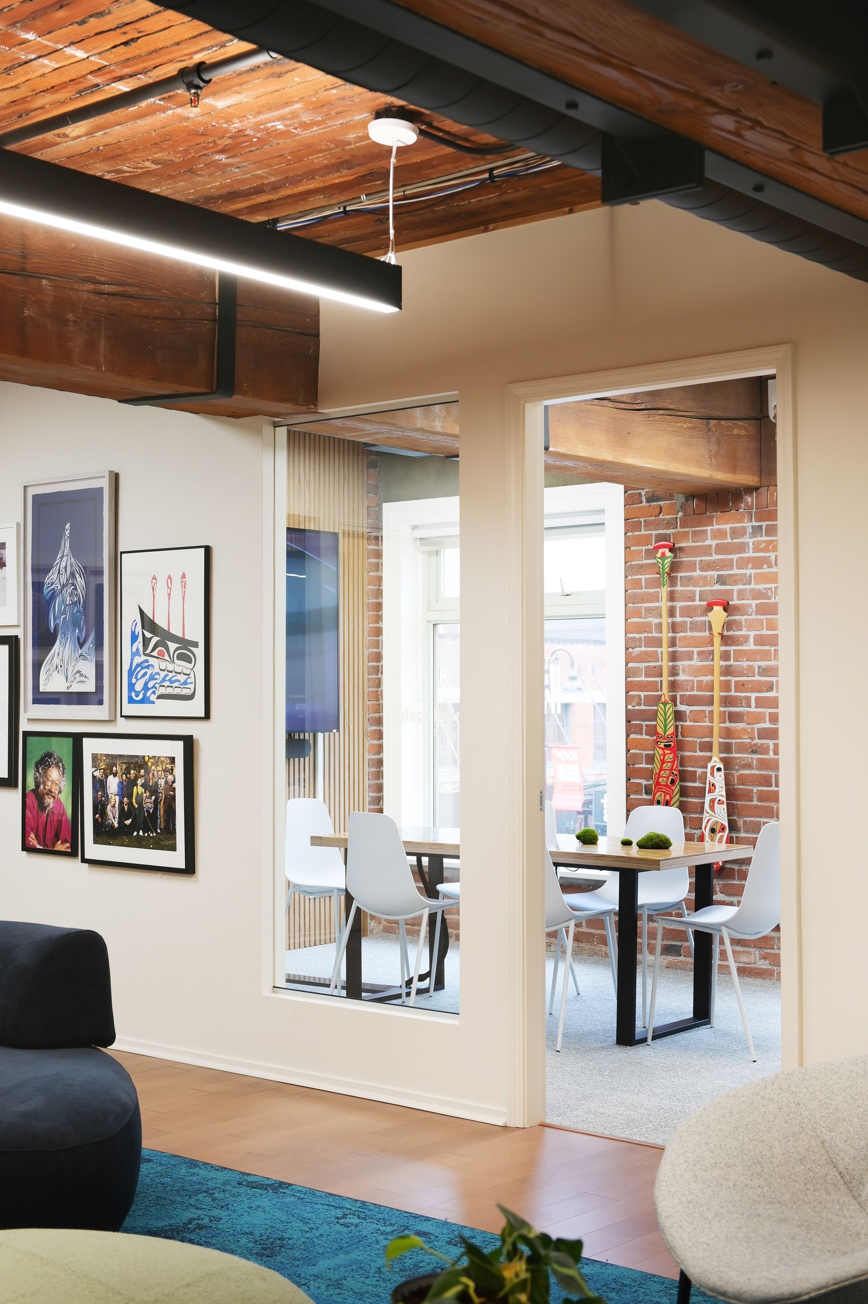 View from the lounge into a small meeting room through the glazed partition