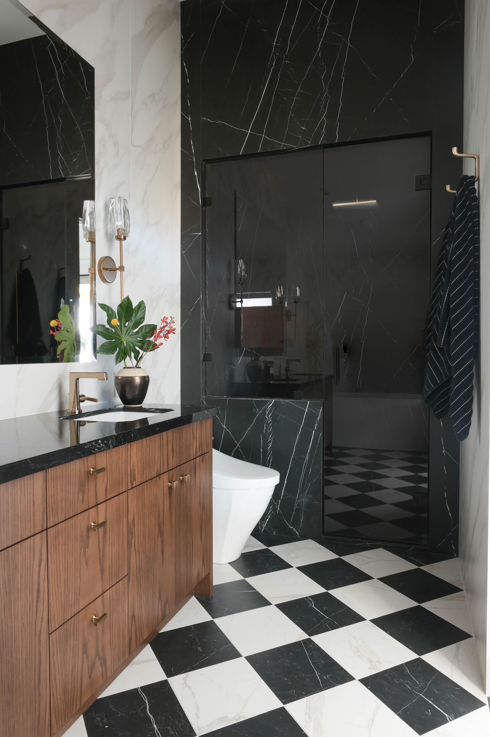 Bathroom with a walnut vanity and checkerboard marble floor