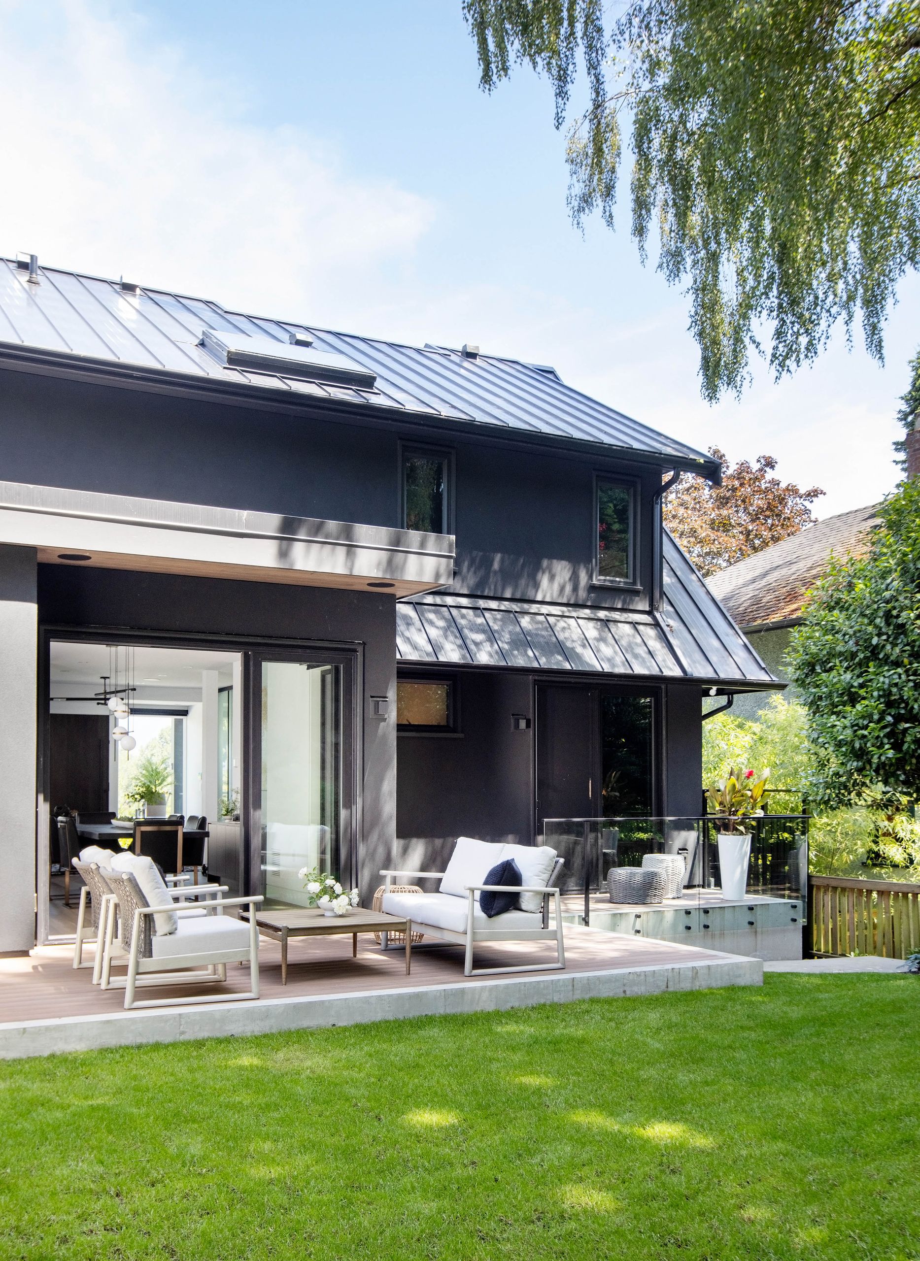 Rear elevation with standing-seam roofs and the deck terrace below